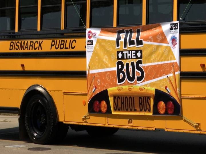 People help local schools during "Fill the Bus" event