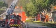 Firefighter, resident injured as large blaze engulfs Gwinnett County apartments