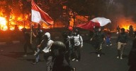 3 dead after mob sets fire to Indonesian regional parliament building