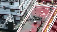 Helicopter crashes into a barge over the Mississippi River, killing 2 people