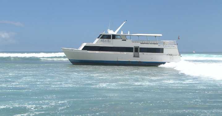 Shuttle boat runs aground outside Kewalo Basin Harbor due to high surf