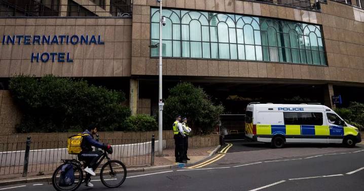 Woman charged with assault tried to force her way into migrant hotel, court told