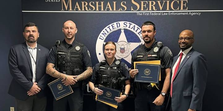 Officers honored by US Marshals Service for capturing quadruple murder suspect Austin Drummond