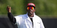 Deion Sanders calls for paying players who reach the playoff and Saban supports the proposal