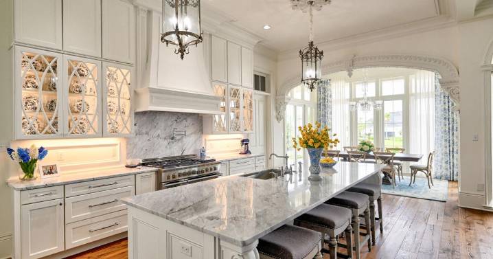 We've learned a lot about interior design from the movies. The white kitchen is the scene stealer.