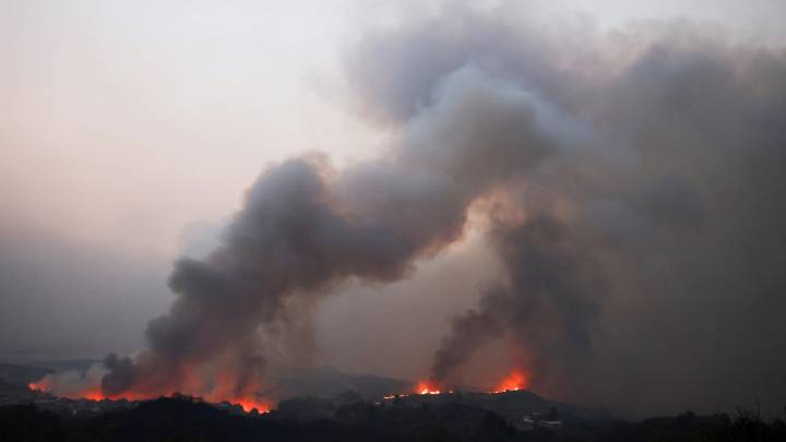 Wildfires 'out of control' in Spain as thousands evacuated and extra 500 troops deployed with holiday hotspots on alert