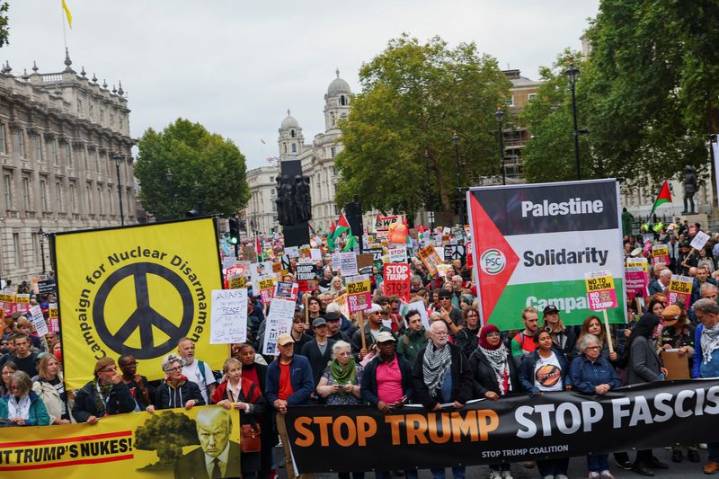 Anti-Trump protesters march through London as president basks in royal welcome