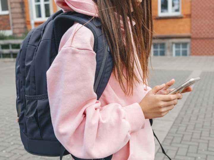 I gave my daughter a cellphone when she was 8. I still don't think they belong in schools.