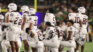 Texas A&M stars pray for Bryce Anderson on field after horror injury sees him stretchered off during Notre Dame game