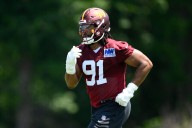 Commanders defensive end Deatrich Wise Jr. carted off the field with right quad injury vs. Packers