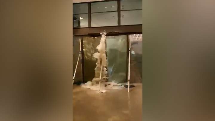 Waves burst through doors of Hong Kong hotel during Typhoon Ragasa