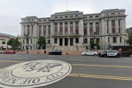 Mayor and top cops accused of sexually harassing female officer