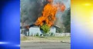 Lane Fire Authority contains garage blaze; investigation underway