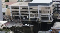 A Bangkok road collapse creates a sinkhole disrupting traffic and prompting evacuations