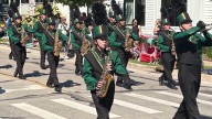 The Naperville Jaycees Labor Day parade marches through downtown Naperville