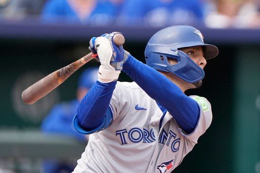 American League-best Blue Jays beat Royals 8-5 and clinch their 1st postseason berth since 2023