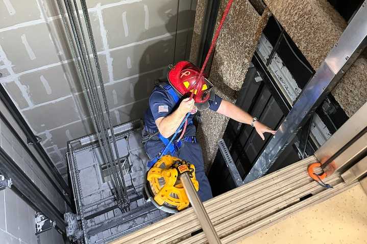 Man rescued via rope after being trapped in elevator for almost 7 hours