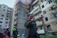 Ukraine government building damaged in Kyiv in the largest Russian attack since the war began
