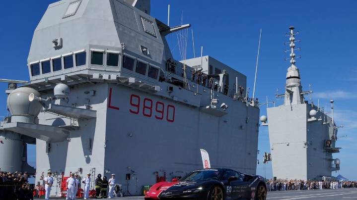 One man in an Italian supercar atop an aircraft carrier has a record in his sights