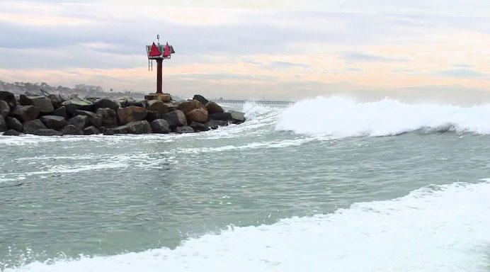 Boat capsizes in Oceanside Harbor amid high surf