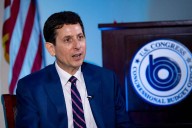 He's the budget scorekeeper for Congress. Lately, it's been a tough job