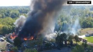 Police remain on scene at burned out Michigan church after shooting and fire leave 4 dead, 8 wounded