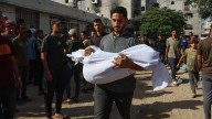 100 killed in one day including children queuing for water in Gaza