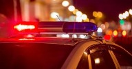 Big rig wedged under bridge in downtown Clarksburg, West Virginia; Route 50 traffic eastbound being diverted