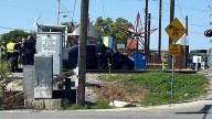 Train hits car stuck on tracks in train depot