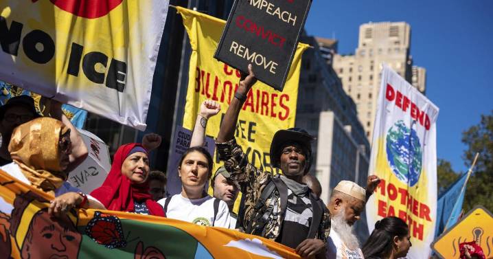 Photos show activists targeting billionaires in a street protest on the eve of New York Climate Week