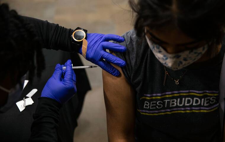 FDA official overruled scientists on wide access to COVID shots