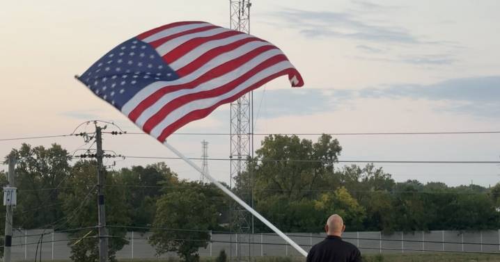 Local man waves flag over I-465 for 24th year to honor 9/11 victims