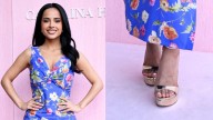 Becky G Floats in Metallic Gold Sandals at Carolina Herrera's Show