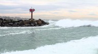 Boat capsizes in Oceanside Harbor amid high surf