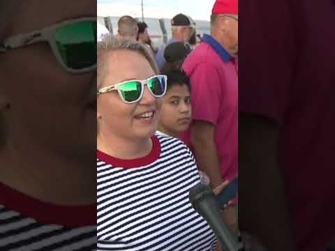 People wait to celebrate and memorialize Charlie Kirk at State Farm Stadium
