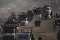 Israeli troops press forward into Gaza City as Palestinians flee
