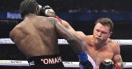 Crawford makes history with victory over Alvarez