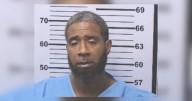 Mobile youth cuts man strangling his mom