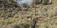 Two local plumbers put out a fire on the Grand Mesa