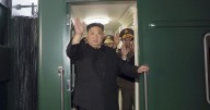 Kim Jong Un rides his trademark green train to China. He also has a plane, limos and white horses