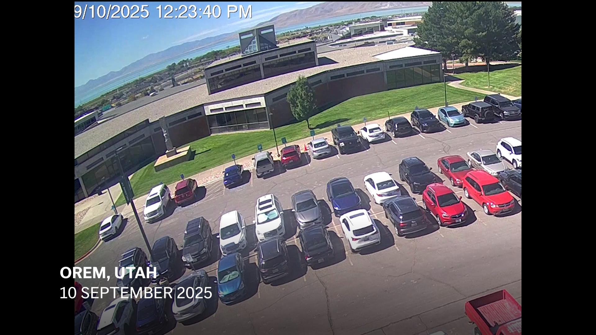 Newly released CCTV footage shows suspect climbing down off roof after Charlie Kirk shooting