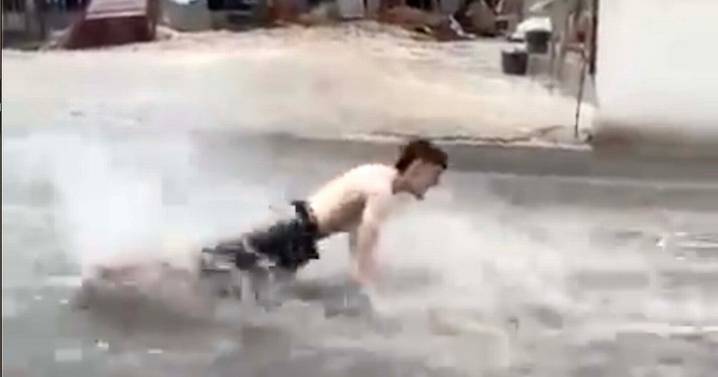 Biblical rain in Benidorm as Brits swim down high street while beaches flood