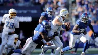 Jim Harbaugh: Justin Herbert is taking too many hits