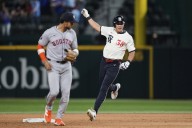 Rangers outlast AL West-leading Astros 4-3 in 12 innings to move closer to playoff spot