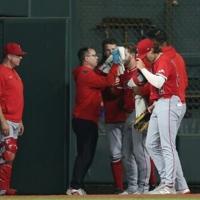 Angels Ward carted off after colliding with scoreboard
