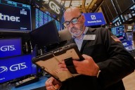 Wall Street ticks toward another record as Tesla vrooms higher