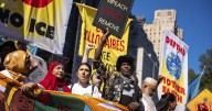 Photos show activists targeting billionaires in a street protest on the eve of New York Climate Week