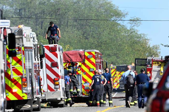 Police remain on scene at burned out Michigan church after shooting and fire leave 4 dead, 8 wounded