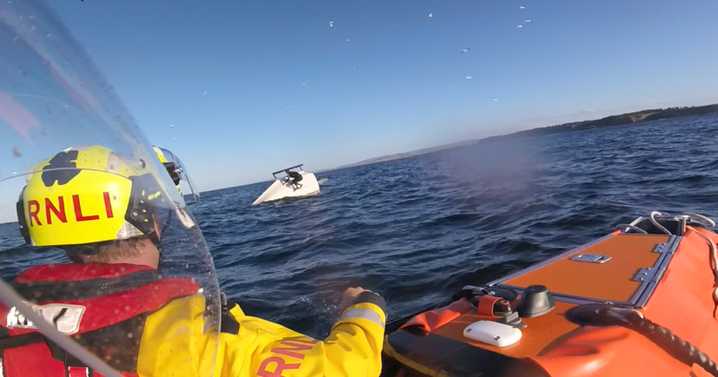 East Lothian RNLI crews called after sailing dinghy capsizes with two on board