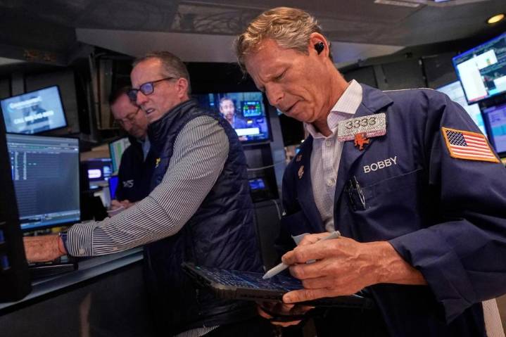 Wall Street ticks toward another record as Tesla vrooms higher